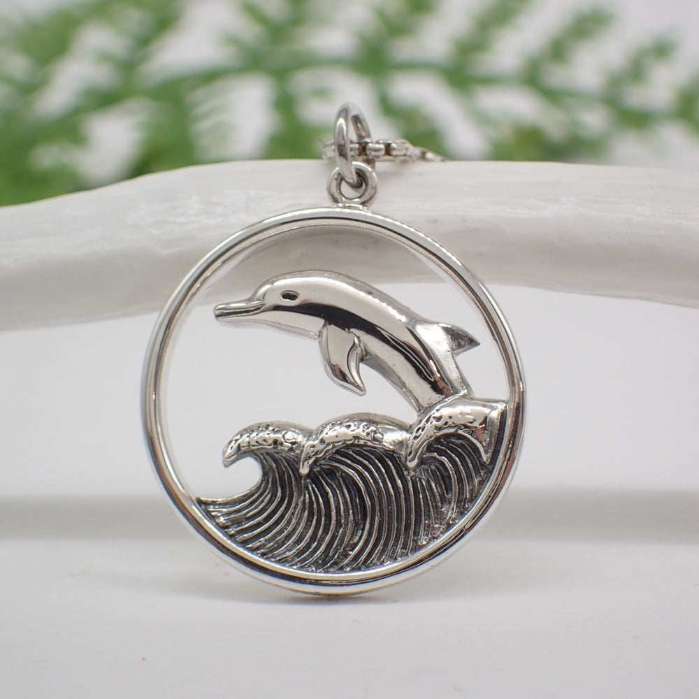 
                  
                    Sterling Silver Dolphin Jumping in Waves Pendant 
                  
                