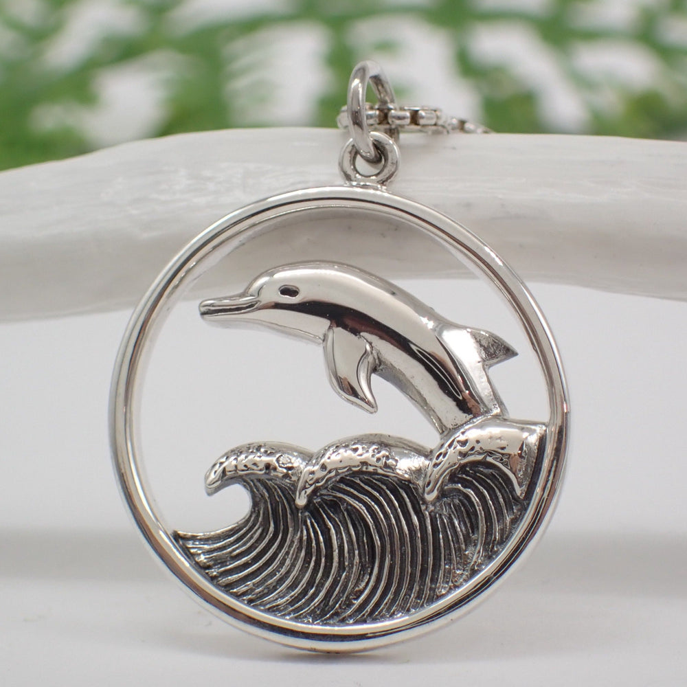 
                  
                    Sterling Silver Dolphin Jumping in Waves Pendant 
                  
                