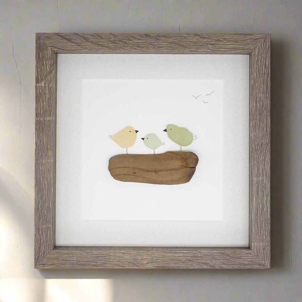 sea glass bird family on driftwood picture