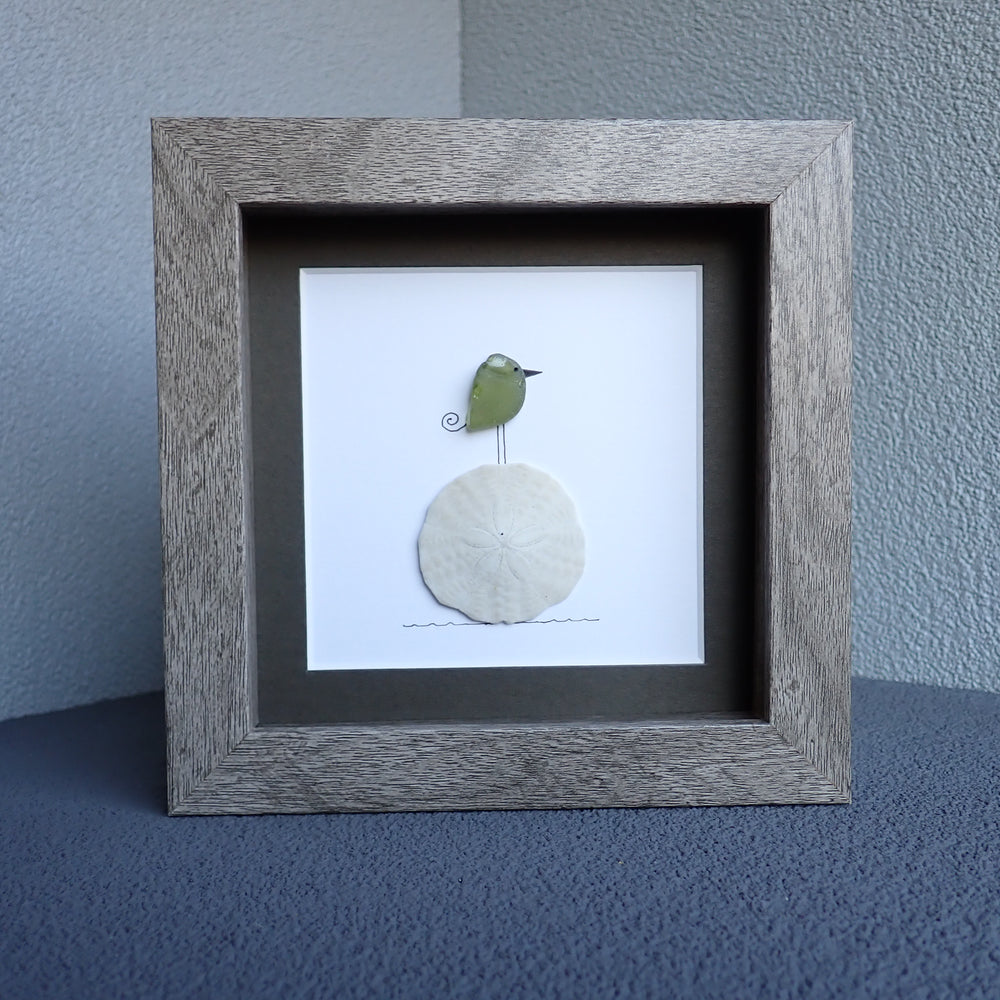 sea glass bird on sand dollar